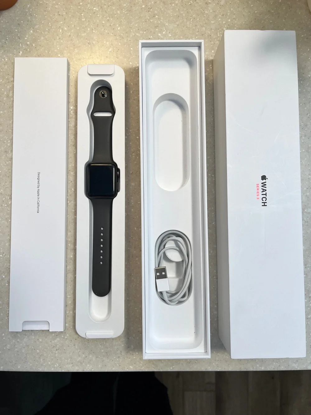 42 mm case Apple Watch with Space Grey Sport Band and Charging Cable